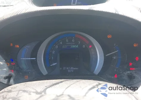 2011 Honda Insight from USA, damaged, VIN JHMZE2H37BS003597